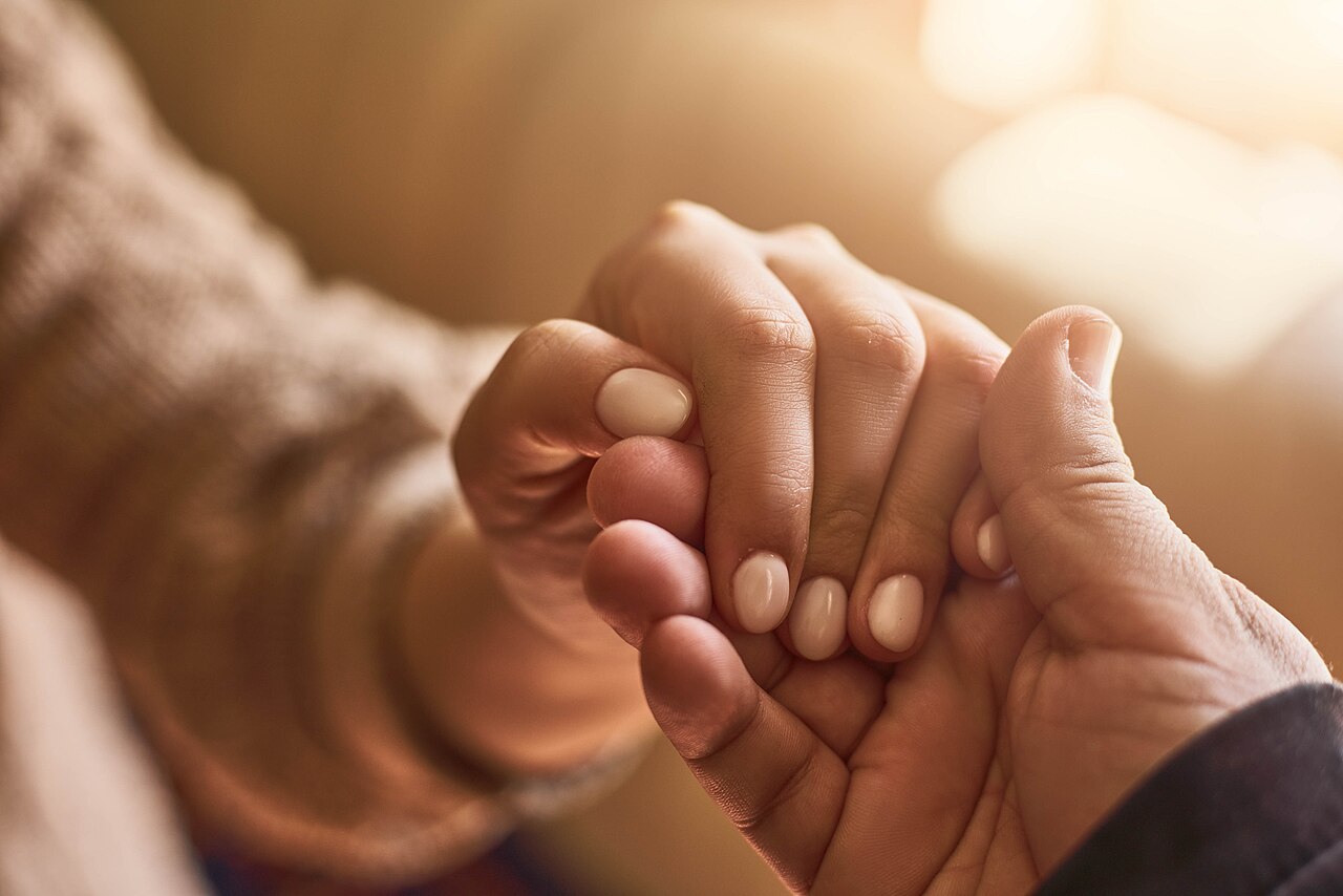 Open hands held palms up in a gesture of compassion and giving